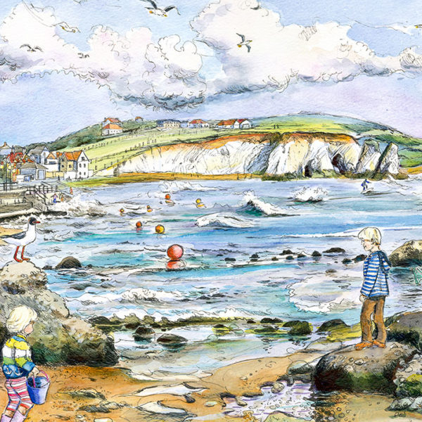 Children playing on the rocks at Freshwater Bay on the Isle of Wight